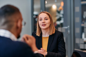 Businesswoman Leading Discussion in Modern Office Setting