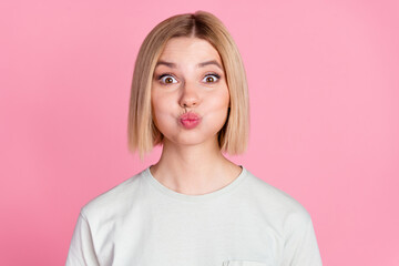 Fototapeta premium Photo of pretty young woman kiss lips wear t-shirt isolated on pink color background