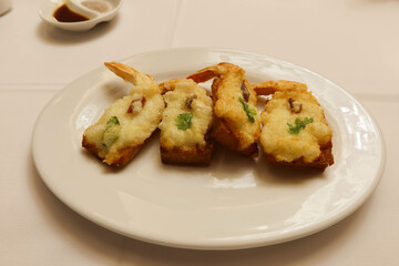 close up of Hong Kong Cantonese style deep fried prawn shrimp toast