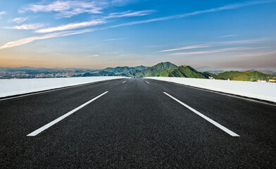 Empty asphalt road and mountains background