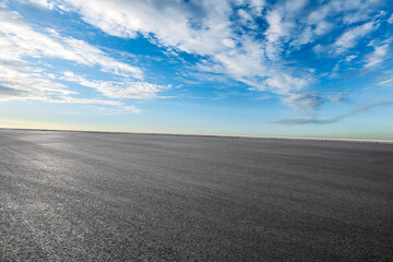 Empty asphalt road and cloudscape on sunny day © zhao dongfang