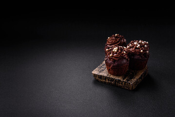 Delicious fresh muffins with filling and chocolate coating