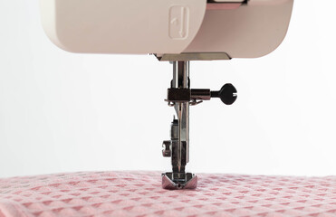 Sewing machine foot and needle plate with needle holder. Macro, industry. Copy space for text, overlock