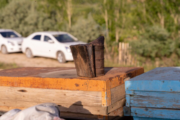 A wooden box with a metal object on top of it