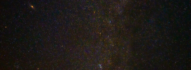 Panorama of the starry sky at night with stars and the Milky Way with galaxies