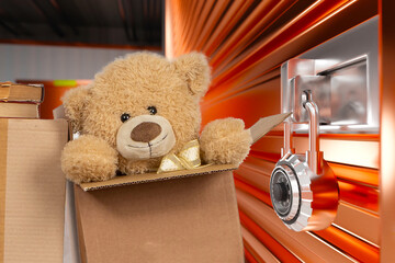 Boxes near self storage. Toys in cardboard containers. Unnecessary things to store in garage. Lock...