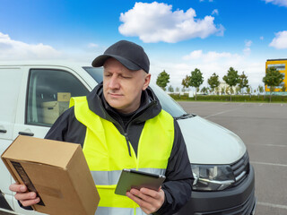 Delivery man from postal service. Courier holding cardboard box. Postal company specialist delivers...