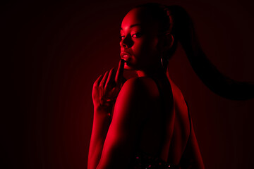 Photo of african lady look touch finger lips feel flirty isolated red color neon background