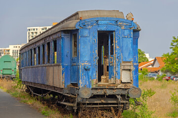Abandoned Blue Train Passenger Carriage at Defunct Railway Station