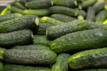 Closeup view of a pile of cucumbers