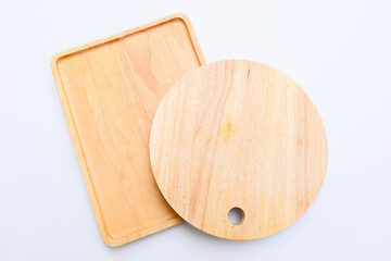 brown wooden tray and sphere cuttingboard isolated on white background