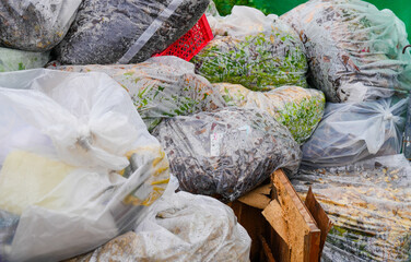 Garbage bags with packaging material