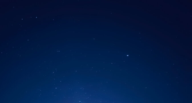 background with blue night sky and starlight points 