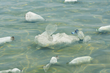Sea with plastic garbage outdoors. Environmental pollution