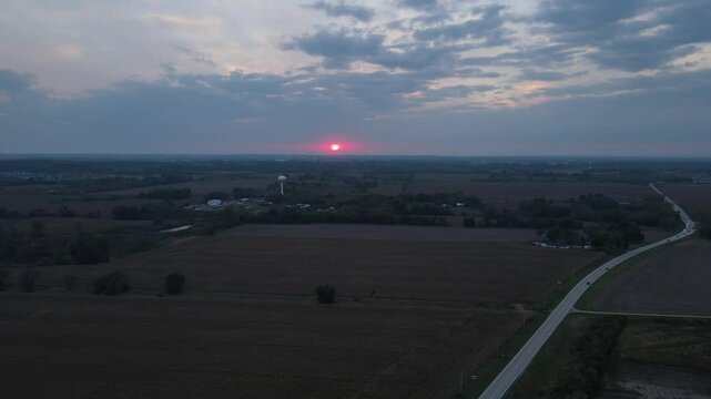 Sunset over corn fields in the midwest. D-log footage.