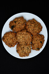 Sweet oatmeal cookies with filling on a white plate. A sweet breakfast.