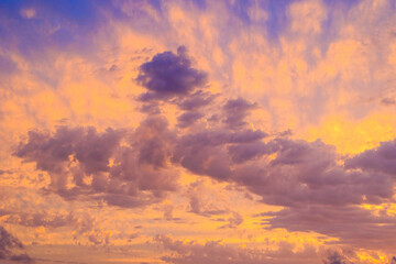 Colourful sunset in the bay of Agios Georgios with dark clouds in front of an intensely orange sky...