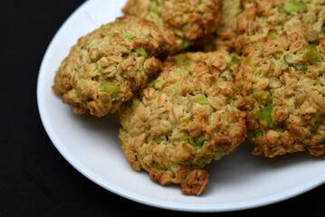 Sweet oatmeal cookies with filling on a white plate. A sweet breakfast.