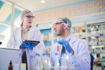 scientist doctors wear lab coat. Chemicals serums and antibiotics are being tested for treatment of people and animals. and make dietary supplements. product testing room clean in a modern laboratory.