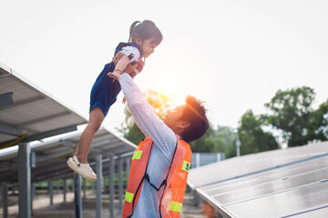 father and daughter by solar panel