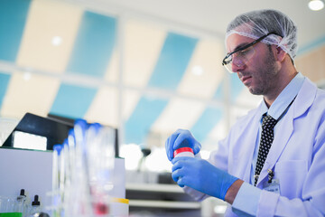 esteemed scientist man elegantly dressed in lab coats are meticulously testing chemicals innovative...