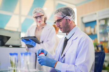 esteemed scientists elegantly dressed in lab coats are meticulously testing chemicals innovative...