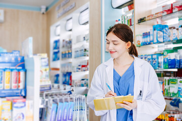 Pharmacy shop manager staff women list products at drugstore, checking listing amount remaining in the store at shelf.