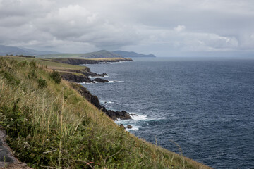 Cloudy Day View of the Irish Coastline With Rolling Green Hills