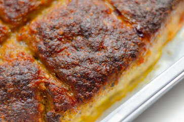 A piece of meat is cooked and has a crispy crust