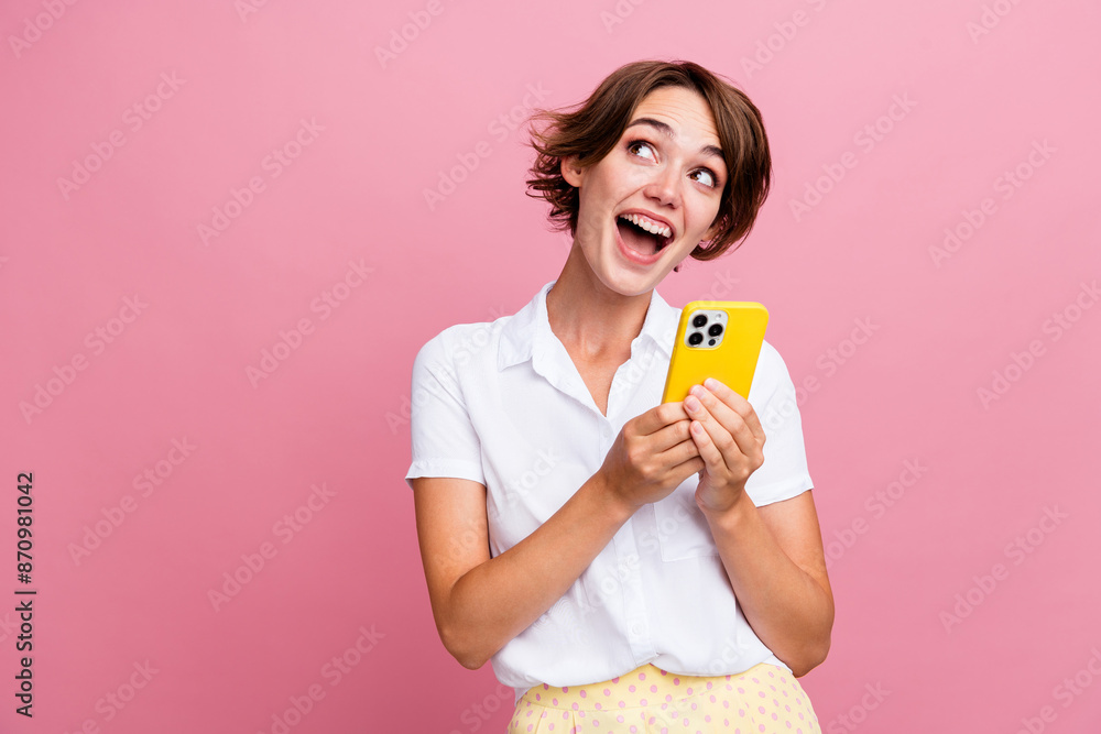 Sticker photo of excited astonished woman with bob hair dressed shirt hold smartphone indicating empty space