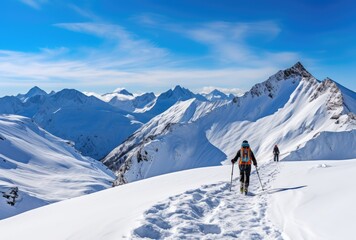 Alpine skier with backpack and trekking poles on the top of a snowy mountain