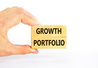 Growth portfolio symbol. Concept words Growth portfolio on beautiful wooden block. Beautiful white paper background. Businessman hand. Business Growth portfolio concept. Copy space.