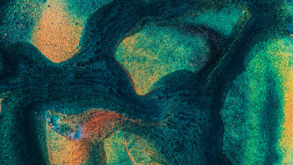 A green and brown abstract painting with a lot of texture