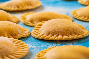 Hand made Ravioli noodles in close up view with soft bokeh background