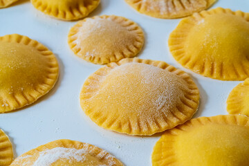 Hand made Ravioli noodles in close up view with soft bokeh background