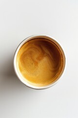 A single serve of hot coffee sitting on a clean white table, ready to be enjoyed