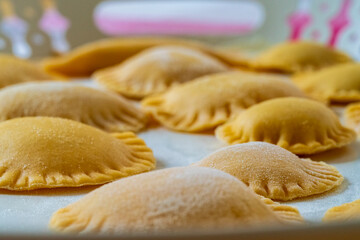 Hand made Ravioli noodles in close up view with soft bokeh background