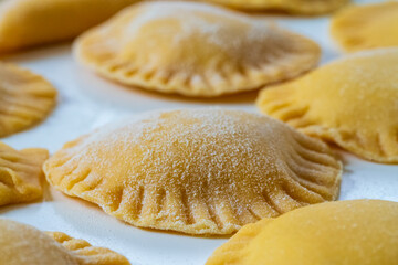 Hand made Ravioli noodles in close up view with soft bokeh background