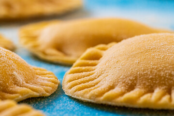 Hand made Ravioli noodles in close up view with soft bokeh background