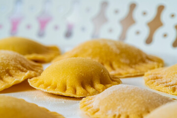 Hand made Ravioli noodles in close up view with soft bokeh background