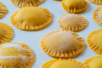 Hand made Ravioli noodles in close up view with soft bokeh background