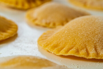 Hand made Ravioli noodles in close up view with soft bokeh background