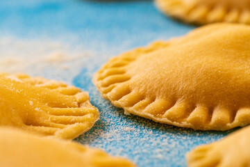 Hand made Ravioli noodles in close up view with soft bokeh background