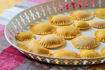 Hand made Ravioli noodles in close up view with soft bokeh background