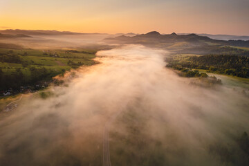 Misty morning in Pieniny Mountains during summer sunrise