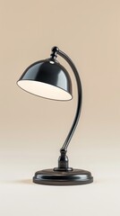 Black desk lamp with white light on beige background, studio shot. Modern home office concept