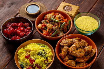 Traditional Moroccan lunch couscous vegetables chicken and dried fruits