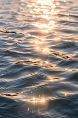 Water surface with light reflections and gentle waves, 