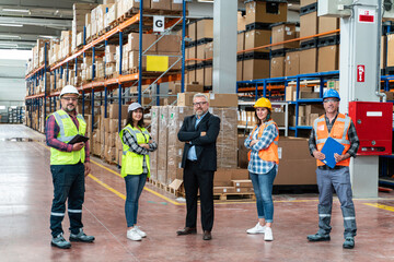 Effective Management in Action: Businessman Engaging and walking with Warehouse Worker and Engineer, Utilizing Digital Tablet 