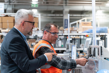 Male industrial worker working with manufacturing equipment in a factory and Professional industrial senior manager